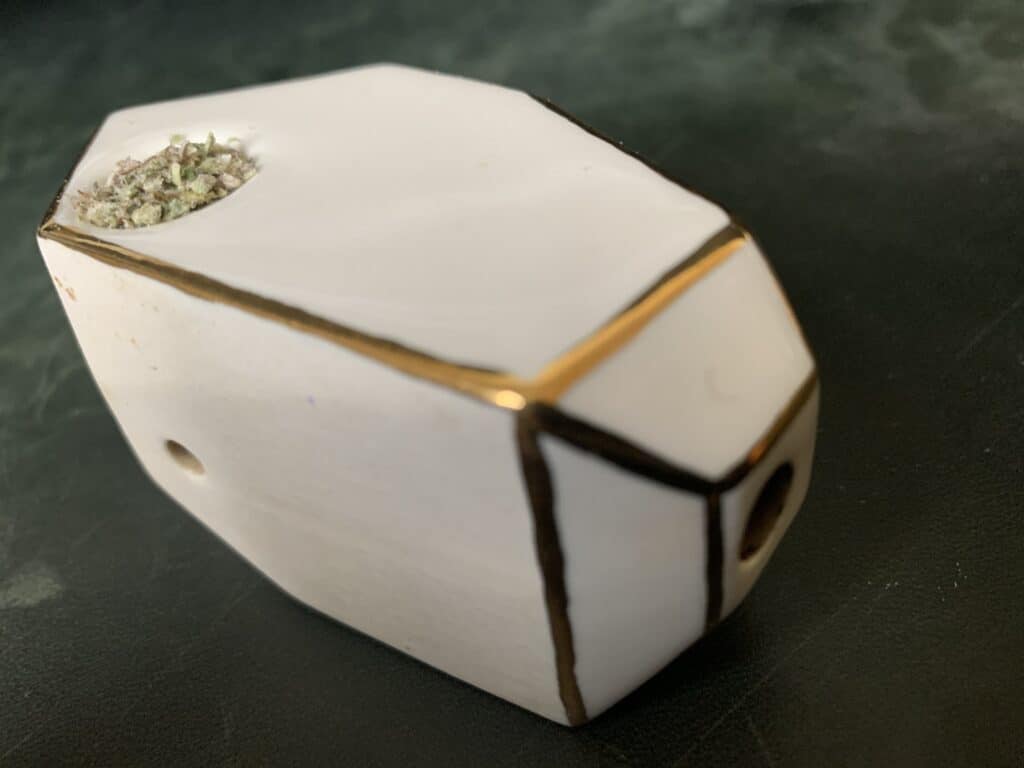 Puffing Pretty On Porcelain Hand Pipes From Stonedware 23 gold outlined porcelain pipe